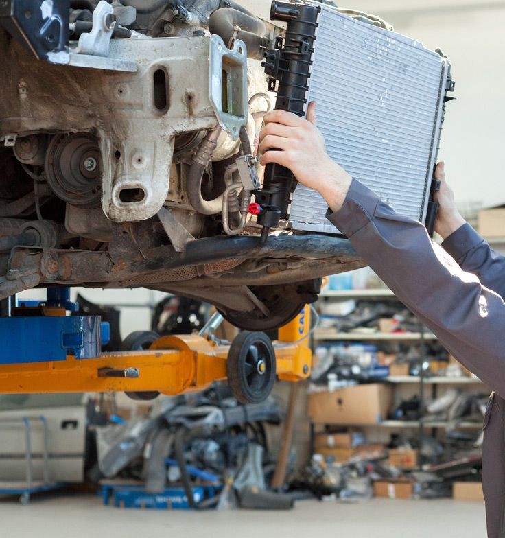 Car Mechanic is Changing the Radiator — Mechanical Repairs in Bundaberg, QLD