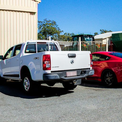 A White 4x4 and Red Sedan — Mechanical Repairs in Bundaberg, QLD