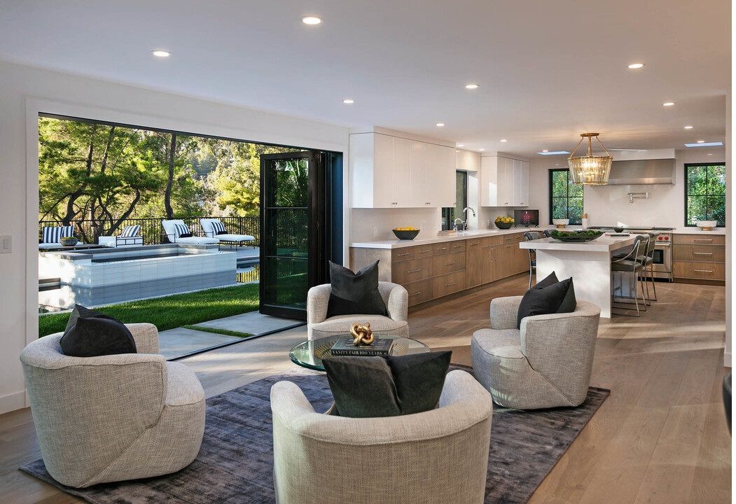 A living room filled with furniture and a large window