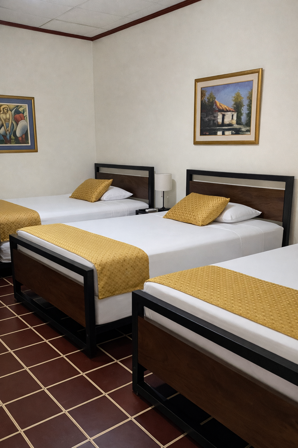 A hotel room featuring three beds with wooden frames, white linens, and yellow runners, set on a tiled floor.