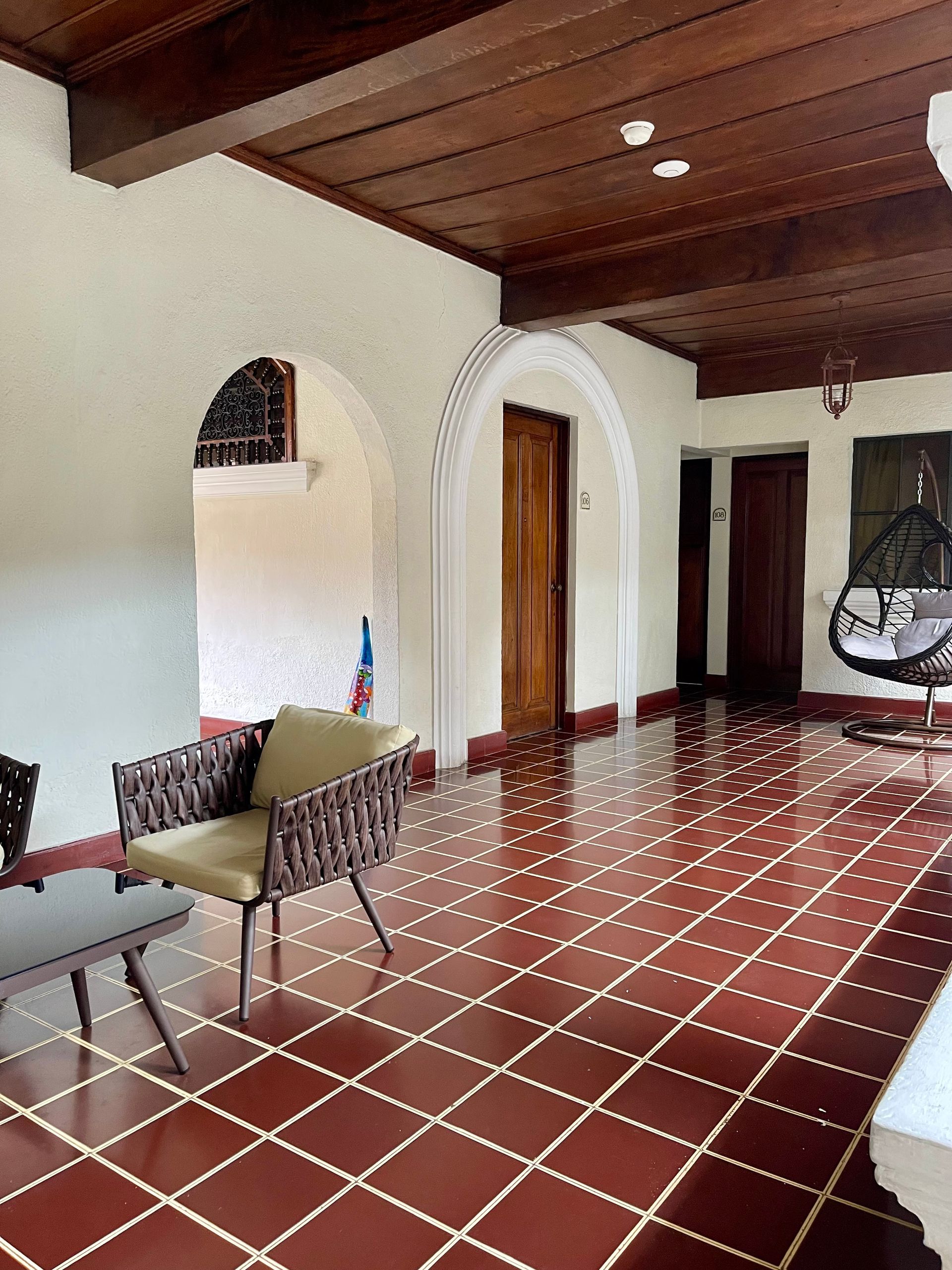 A living room with a chair and a table in it