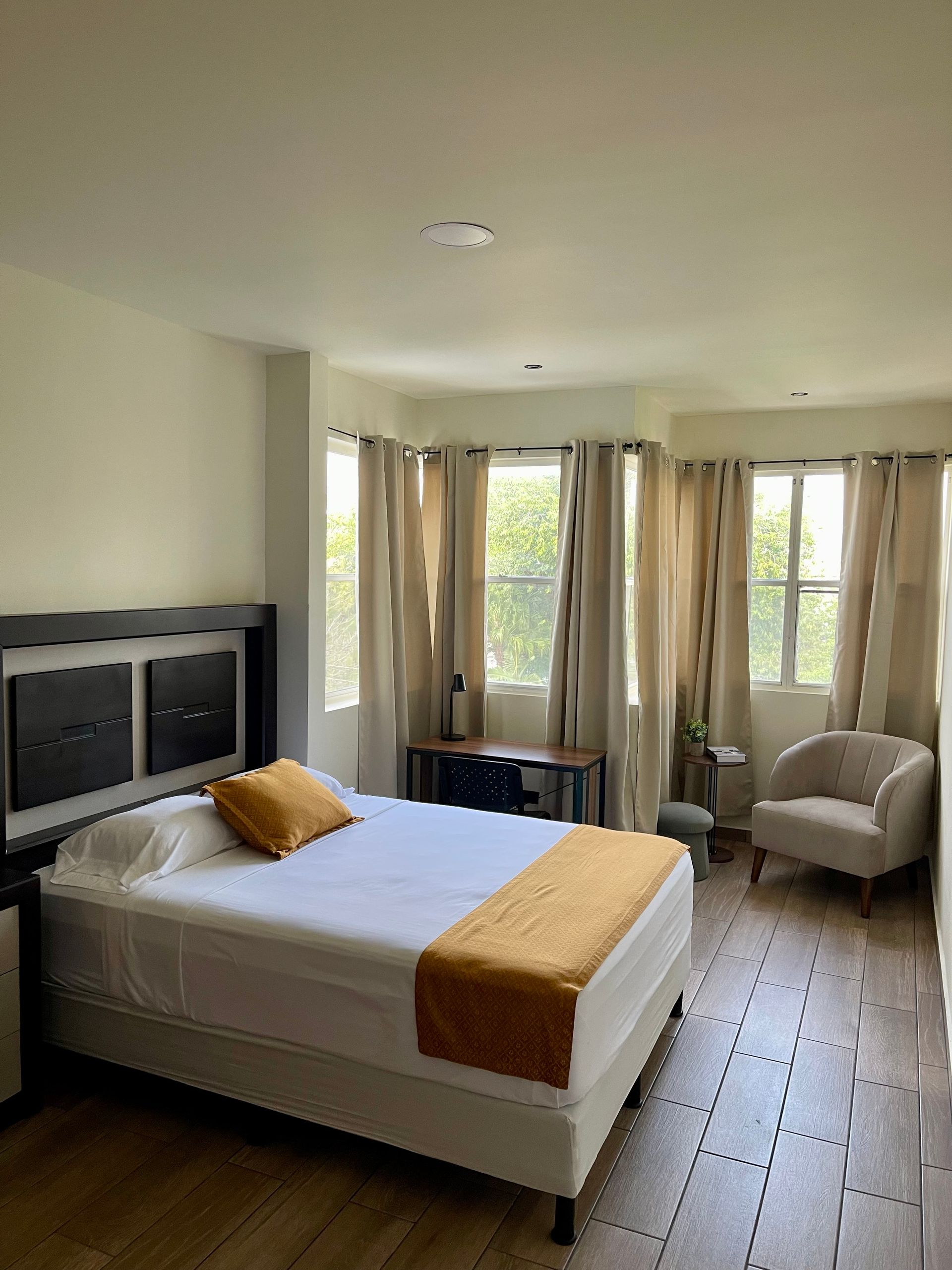 There is a large bed in the middle of the room.