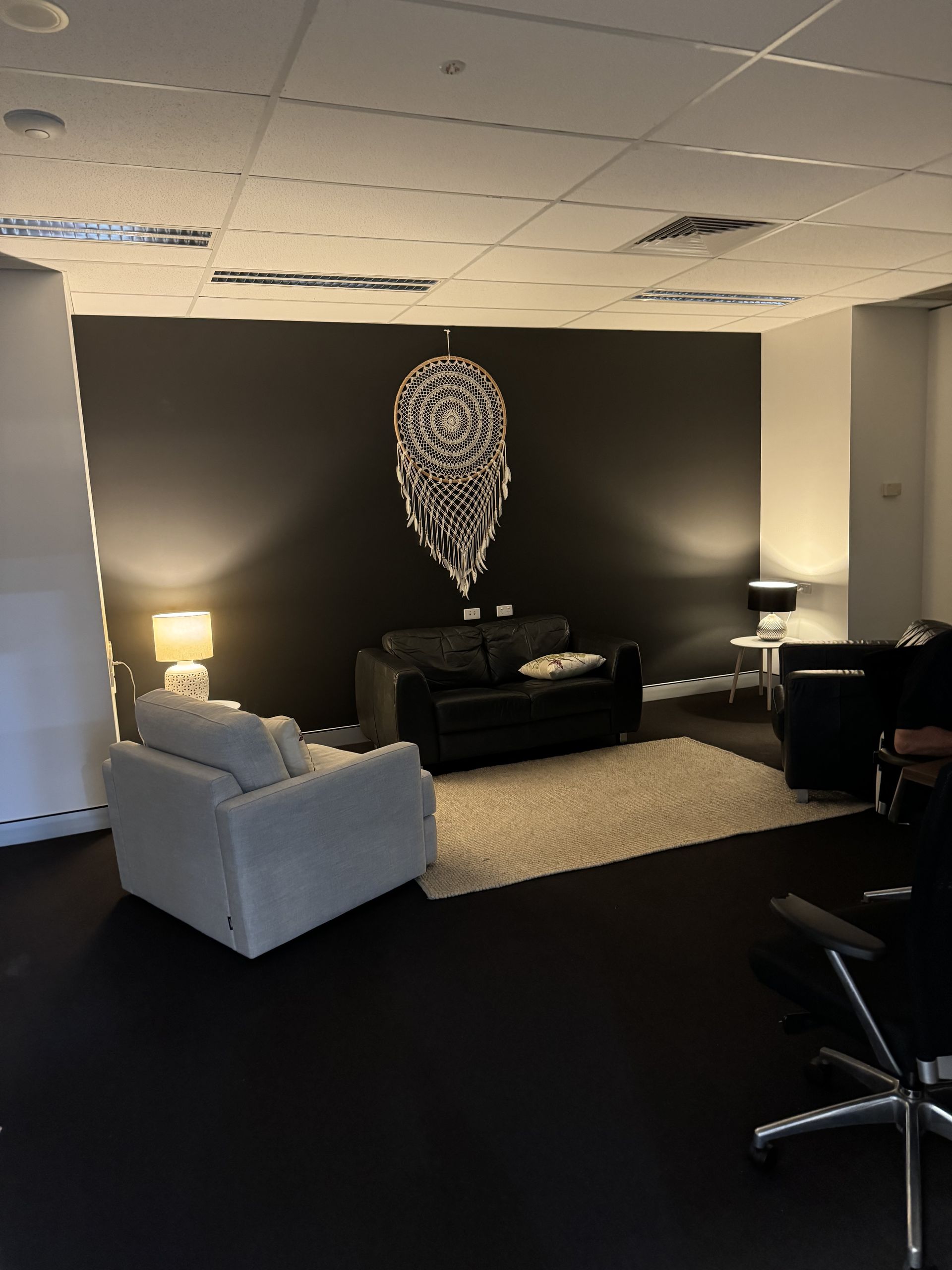 A Living Room With A Couch And A Chair — The Therapists Cairns In Cairns City, QLD