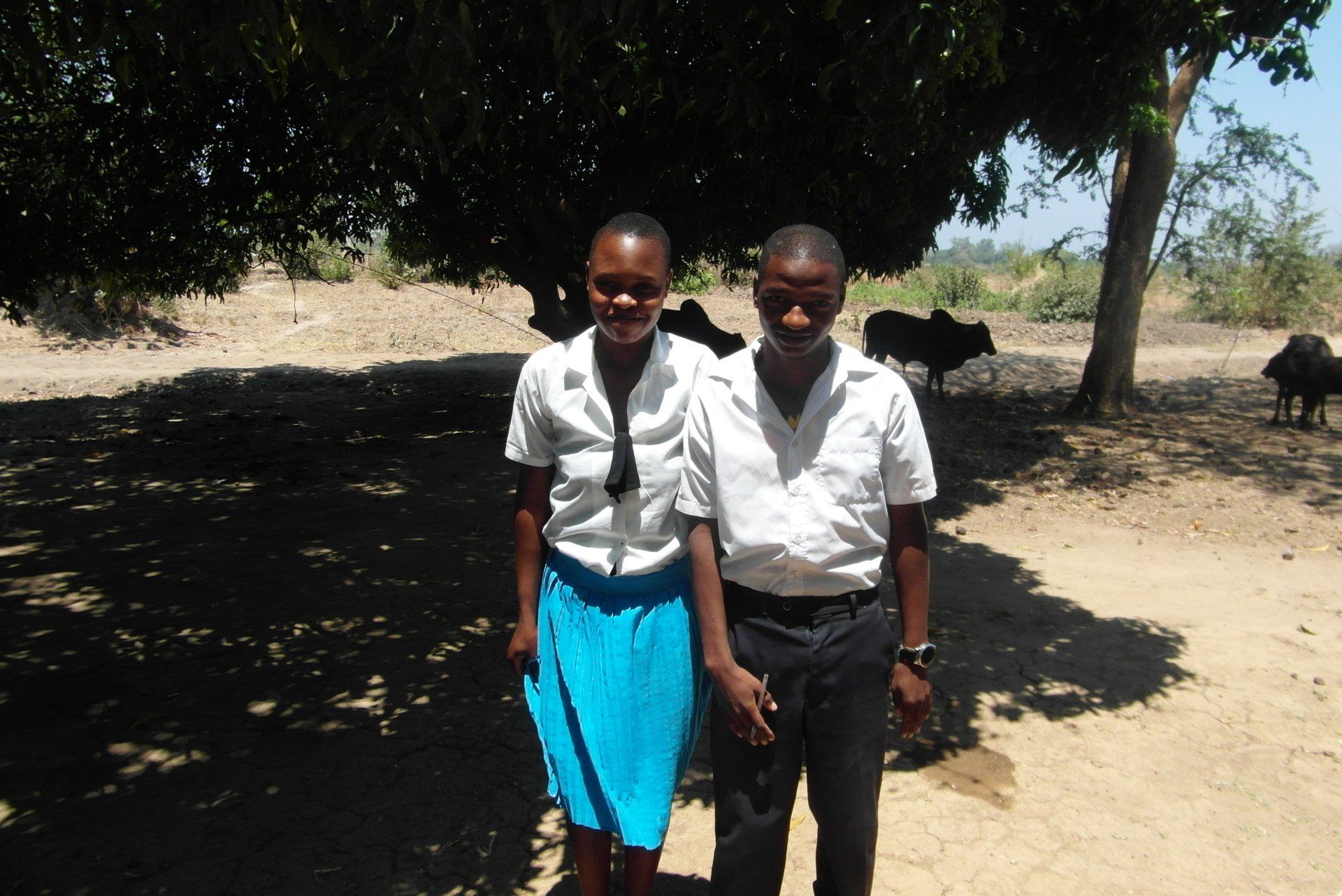 Two teenagers who have manages to attend secondary school in Malawi thanks to the 90kg Rice Challenge