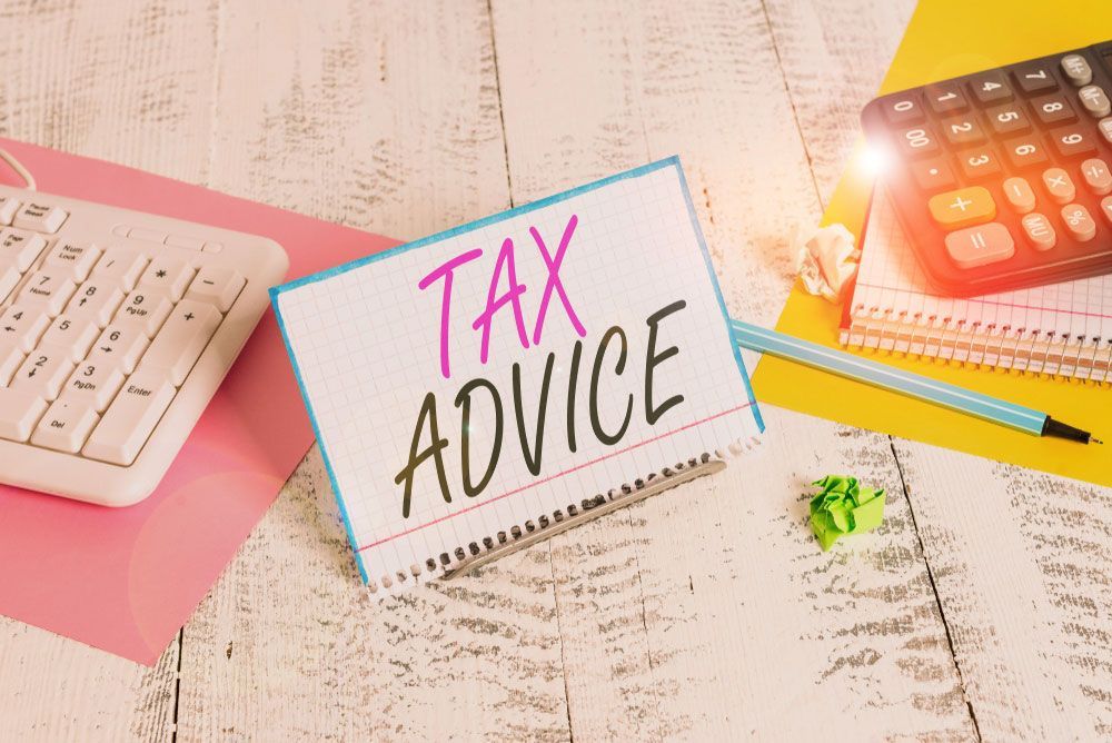 Tax Advice Is Sitting On A Wooden Table — Dynamic Accounting Taxation Advisors in Terrigal, NSW