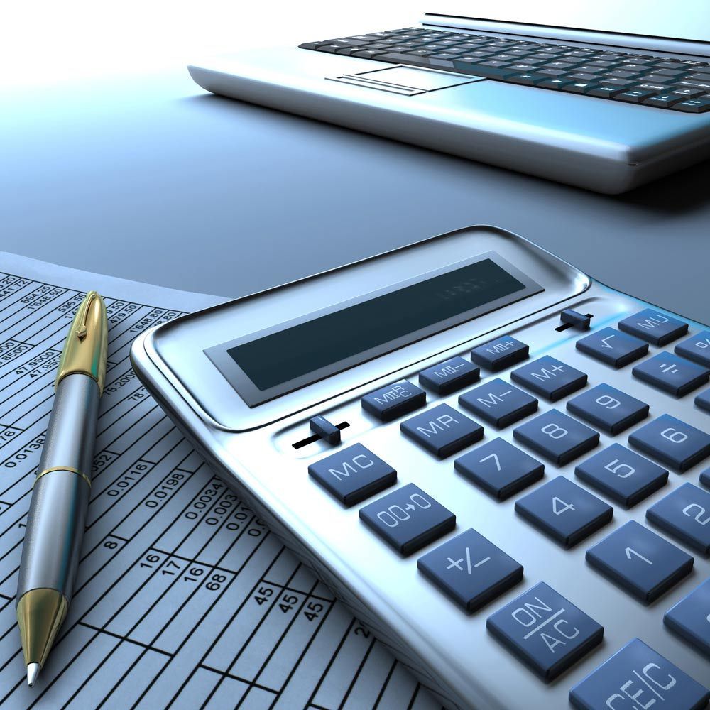 A Calculator Sits On A Table Next To A Pen And A Laptop — Dynamic Accounting Taxation Advisors in Terrigal, NSW