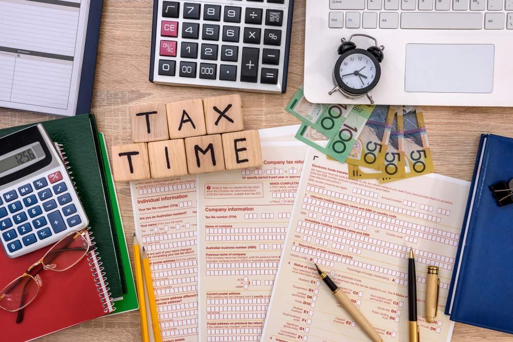 Australian Tax Time Word, Tax Form With Money On Table — Dynamic Accounting Taxation Advisors in Wamberal, NSW