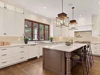 There is a large island in the middle of the kitchen.