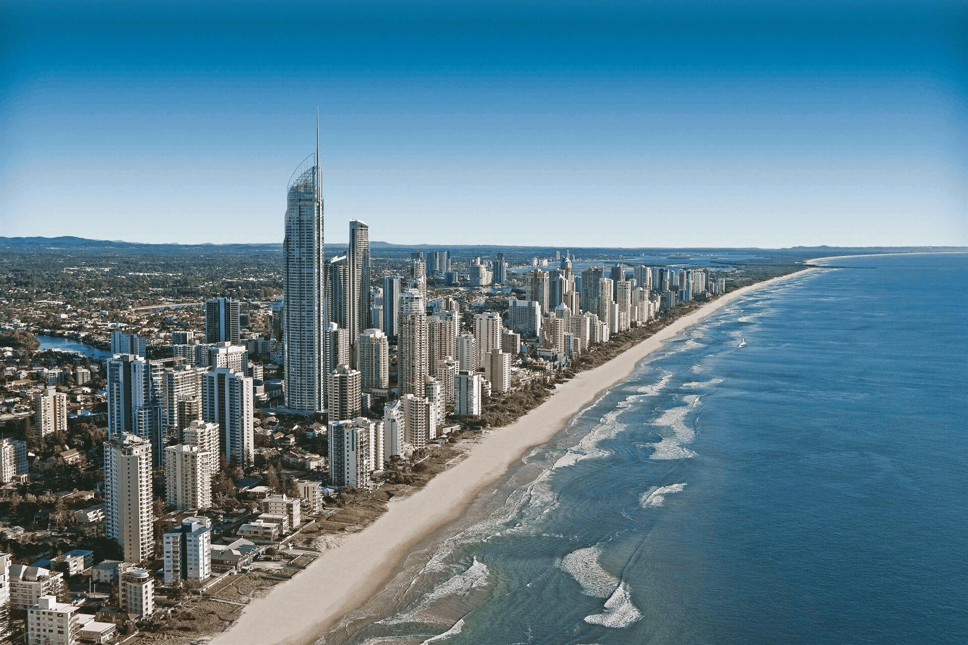 An aerial view of a city near the ocean