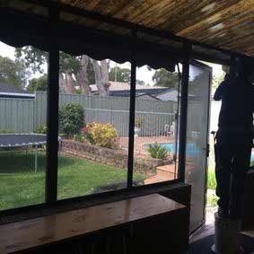 Installing Screen Door — Jamisontown, NSW — Stained Glass Overlay Penrith