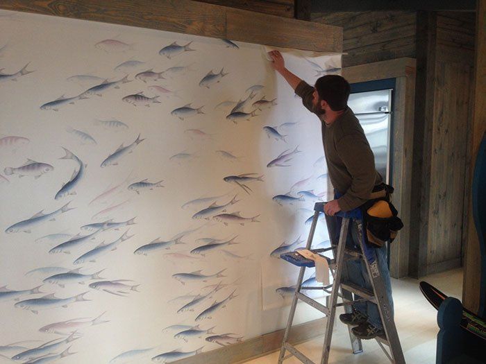 Wallpaper — Man Painting Fishes in Birmingham, AL