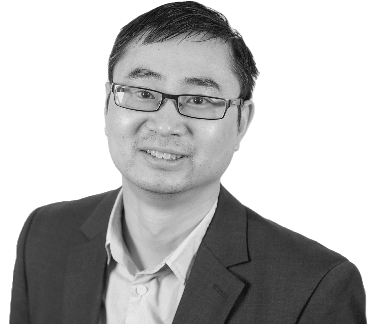 Man with glasses, wearing a suit jacket and dress shirt, smiling for the camera.