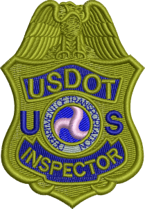 A badge that says usdot inspector on it