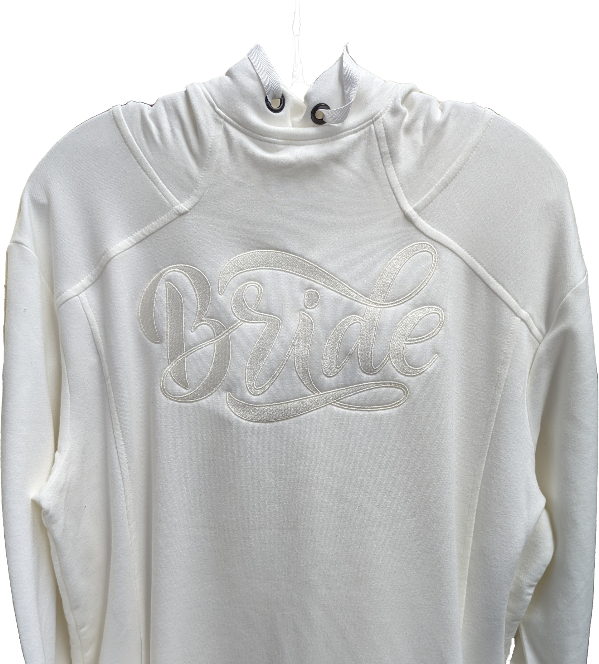 A white sweatshirt with a hood is hanging on a hanger.