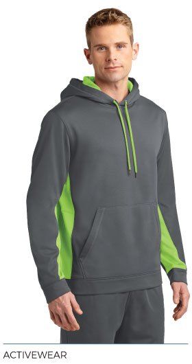 A man is wearing a gray and green hoodie.
