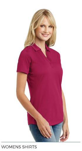 A woman is wearing a pink polo shirt and jeans.