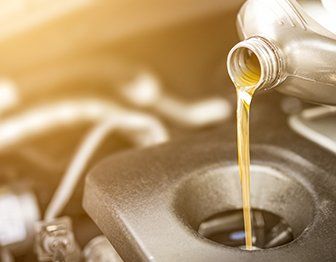 Automotive Repair— Motor Oil Pouring in Round Lake Park, IL