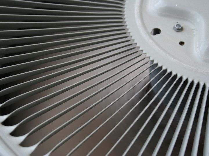 A close up of a fan with a hole in the middle