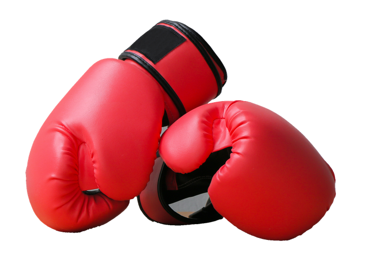 Red boxing gloves, one resting on top of the other. Red boxing gloves, one resting on top of the other.