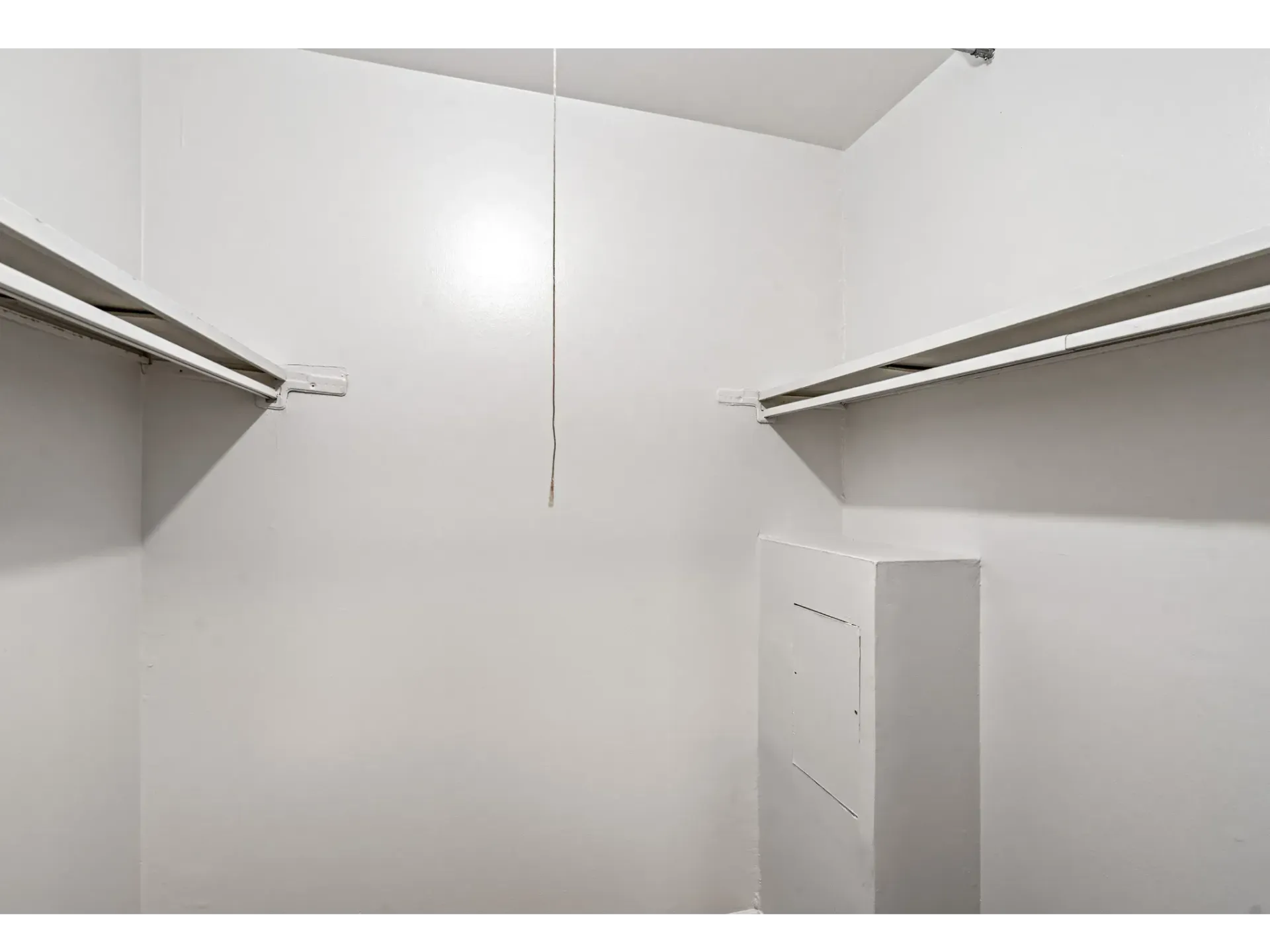 Empty white closet with shelves
