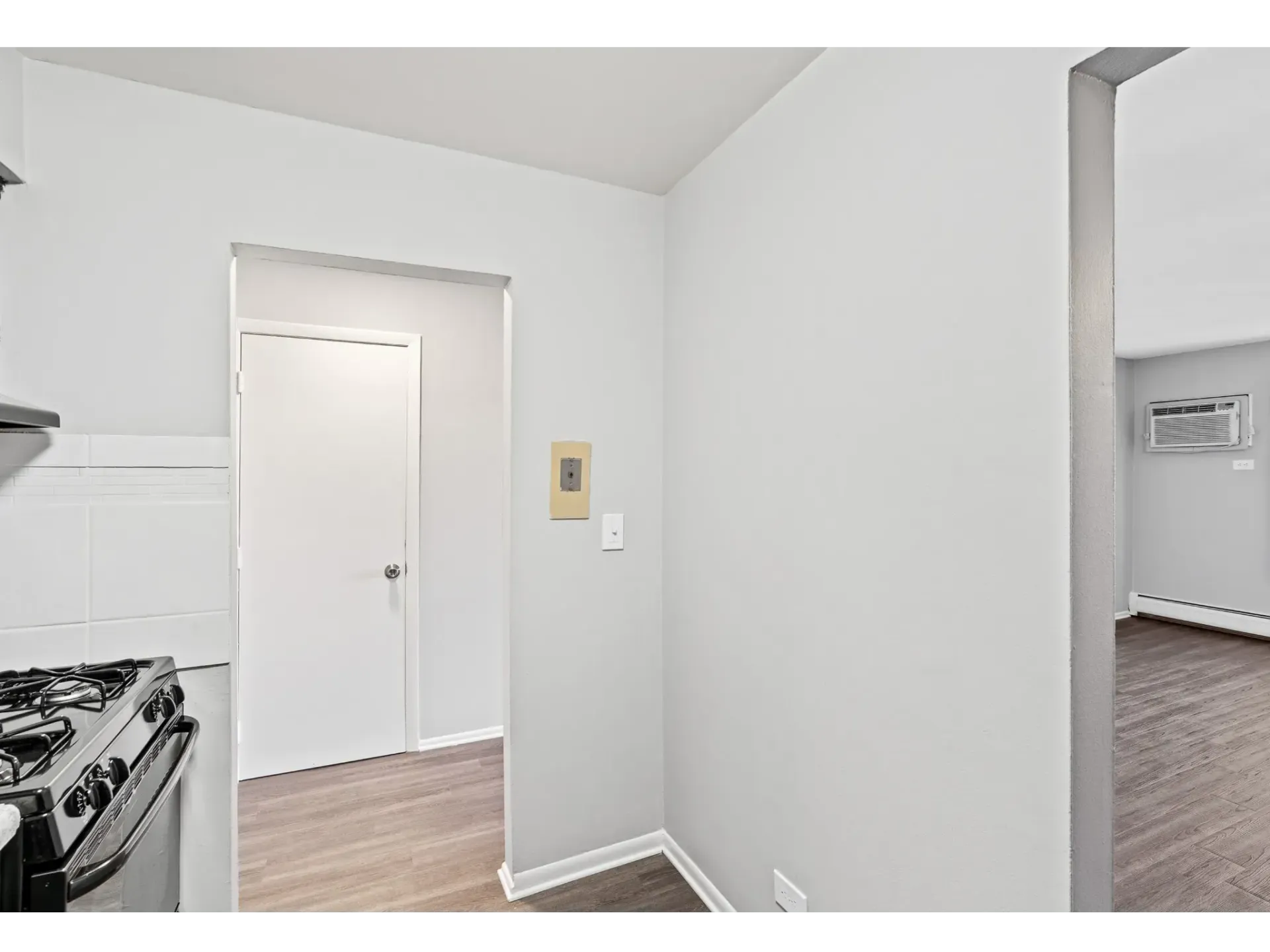 Kitchen corner with doorway leading to a room
