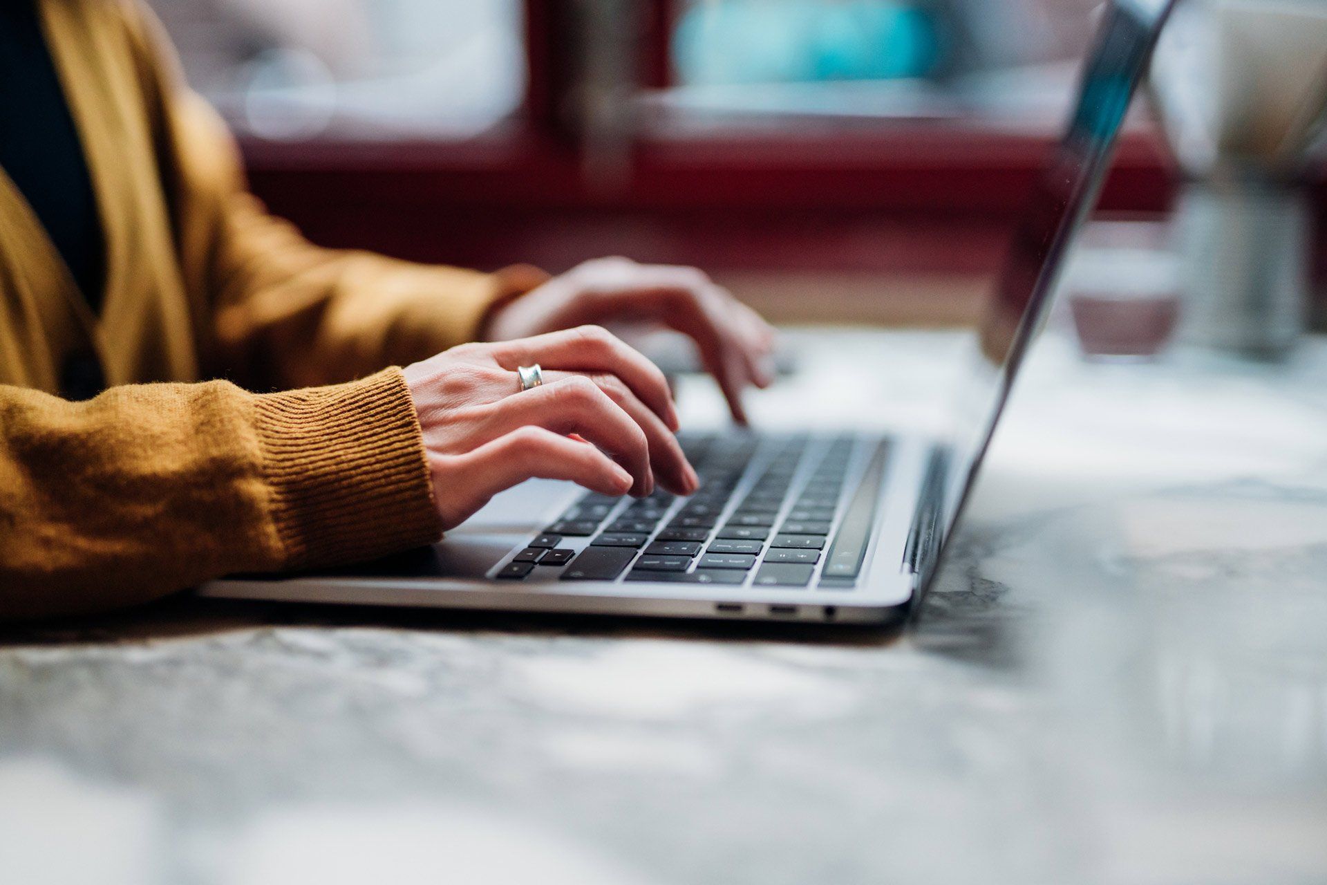 Closeup Shot Of An Unrecognizable Woman Using Laptop — Melbourne VIC — Zonne Building Surveyors & Consultants