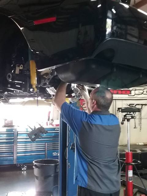 Man fixing chasis - Auto Repair in Poughquag, NY