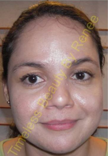 A close up of a woman 's face with the words timeless beauty beneath it