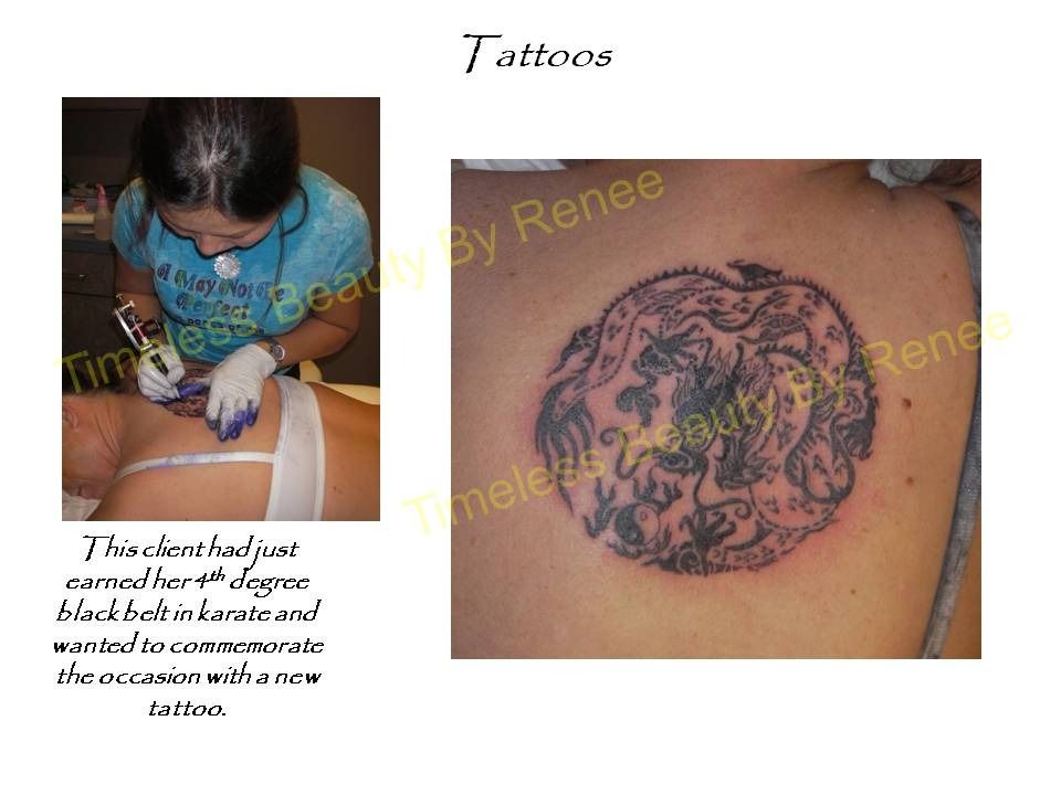 A woman is getting a tattoo on her back by renee