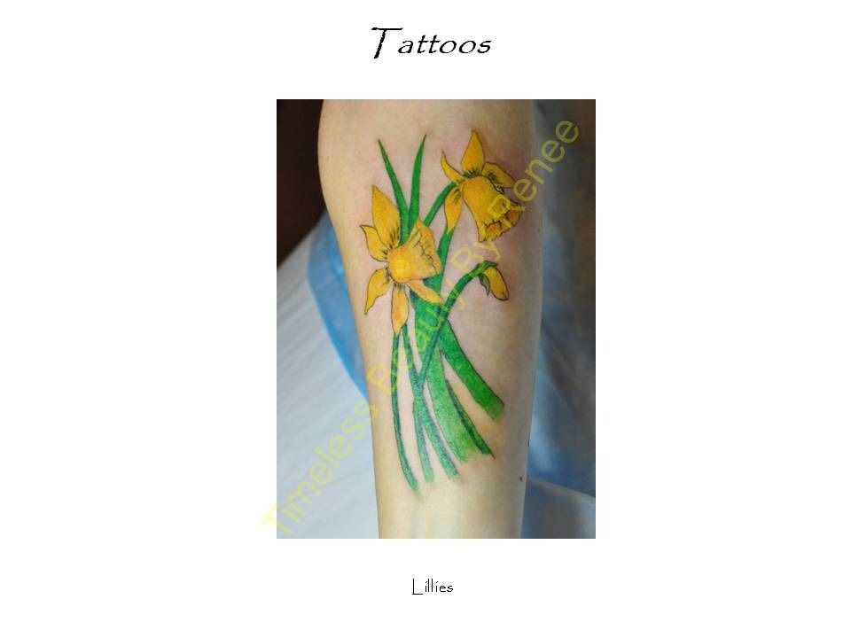 A tattoo of a bunch of yellow flowers on a person 's arm