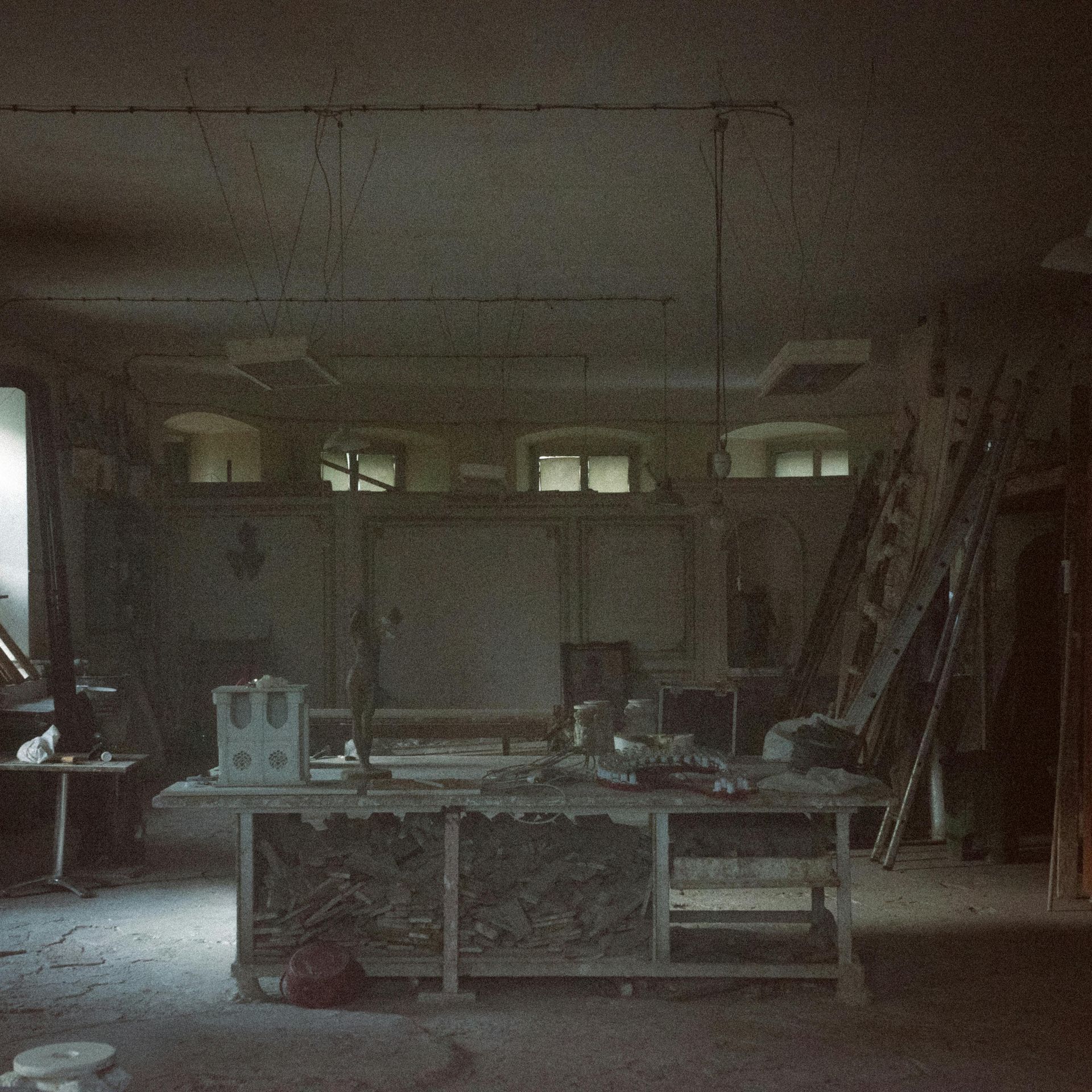 A dark room with a table in the middle of it