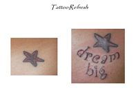 A tattoo of a star and the words `` dream big '' on a person 's back.