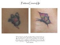 A tattoo cover up of a butterfly on a woman 's back.