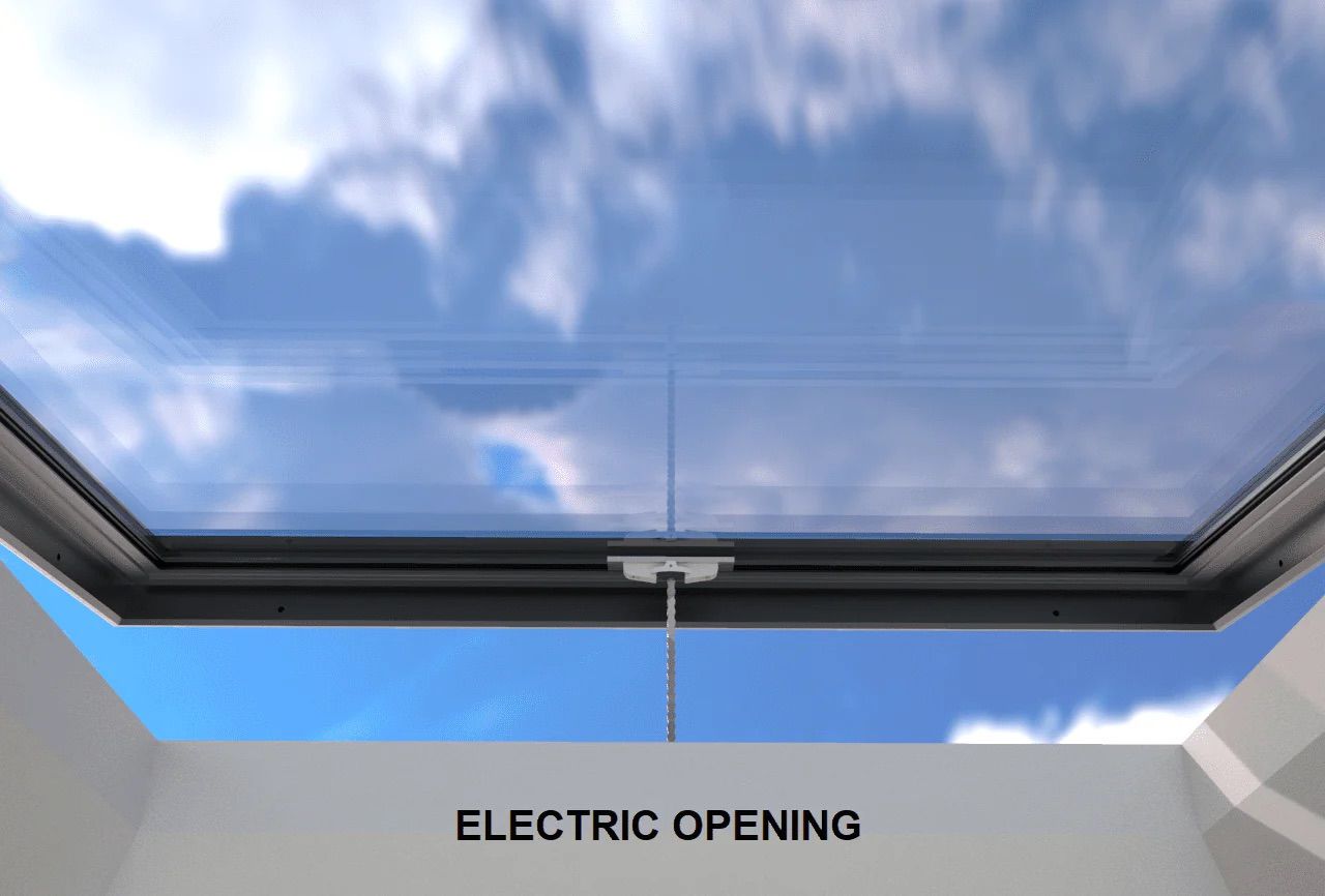 An electric-opening skylight against a blue sky with clouds. The skylight is open, showing the sky above.