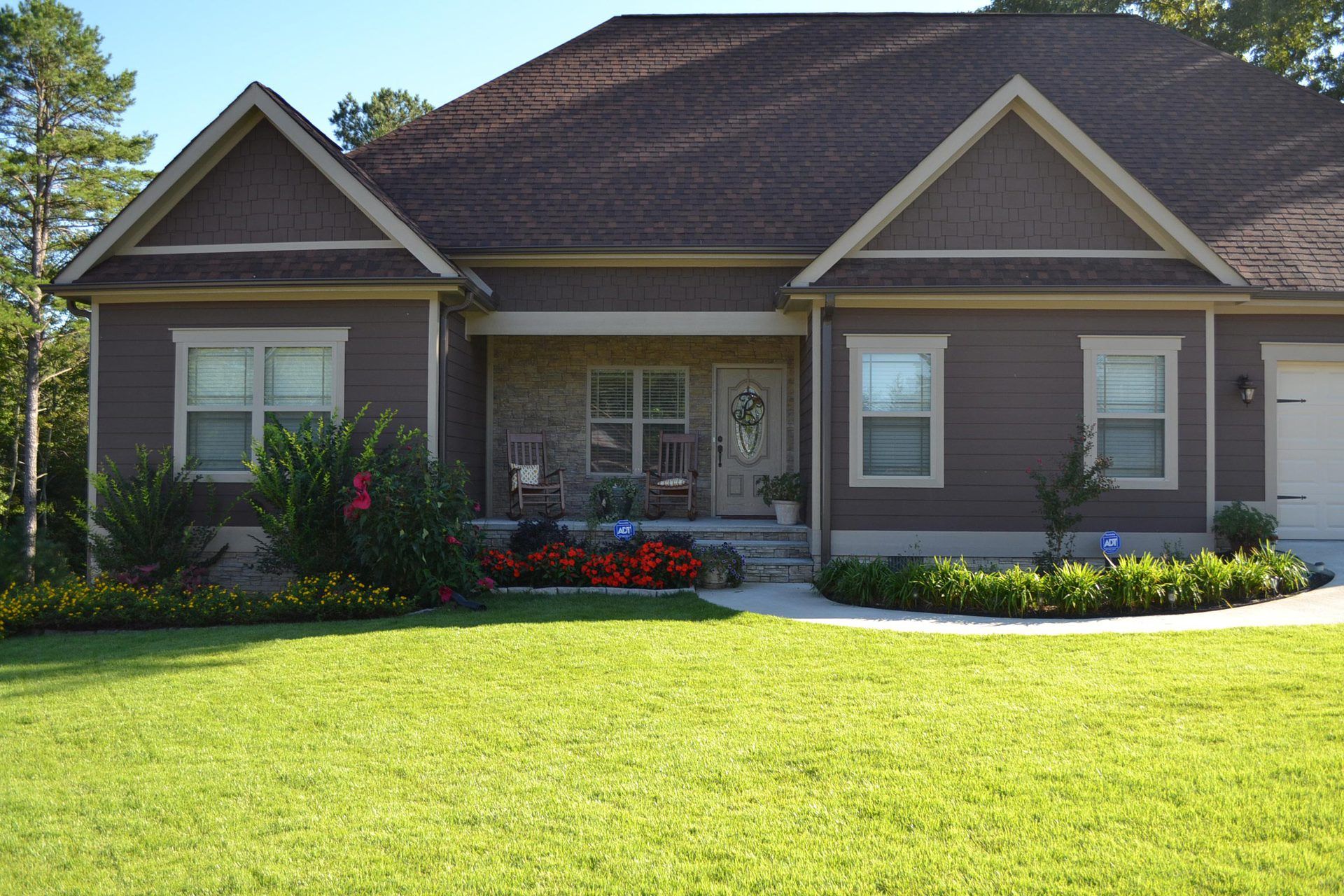 A house with brown siding and a brown roof