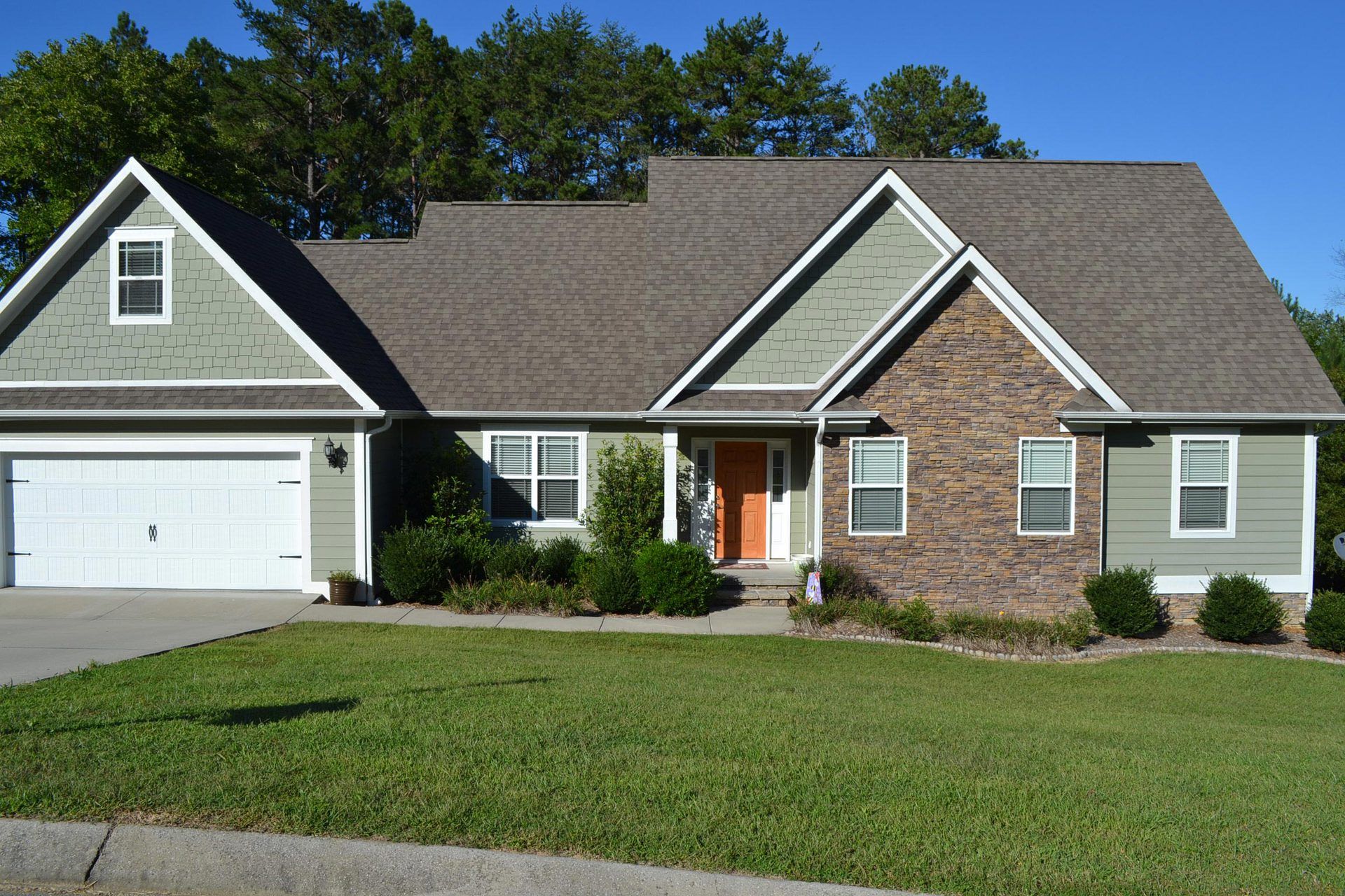 The front of a house with a large garage
