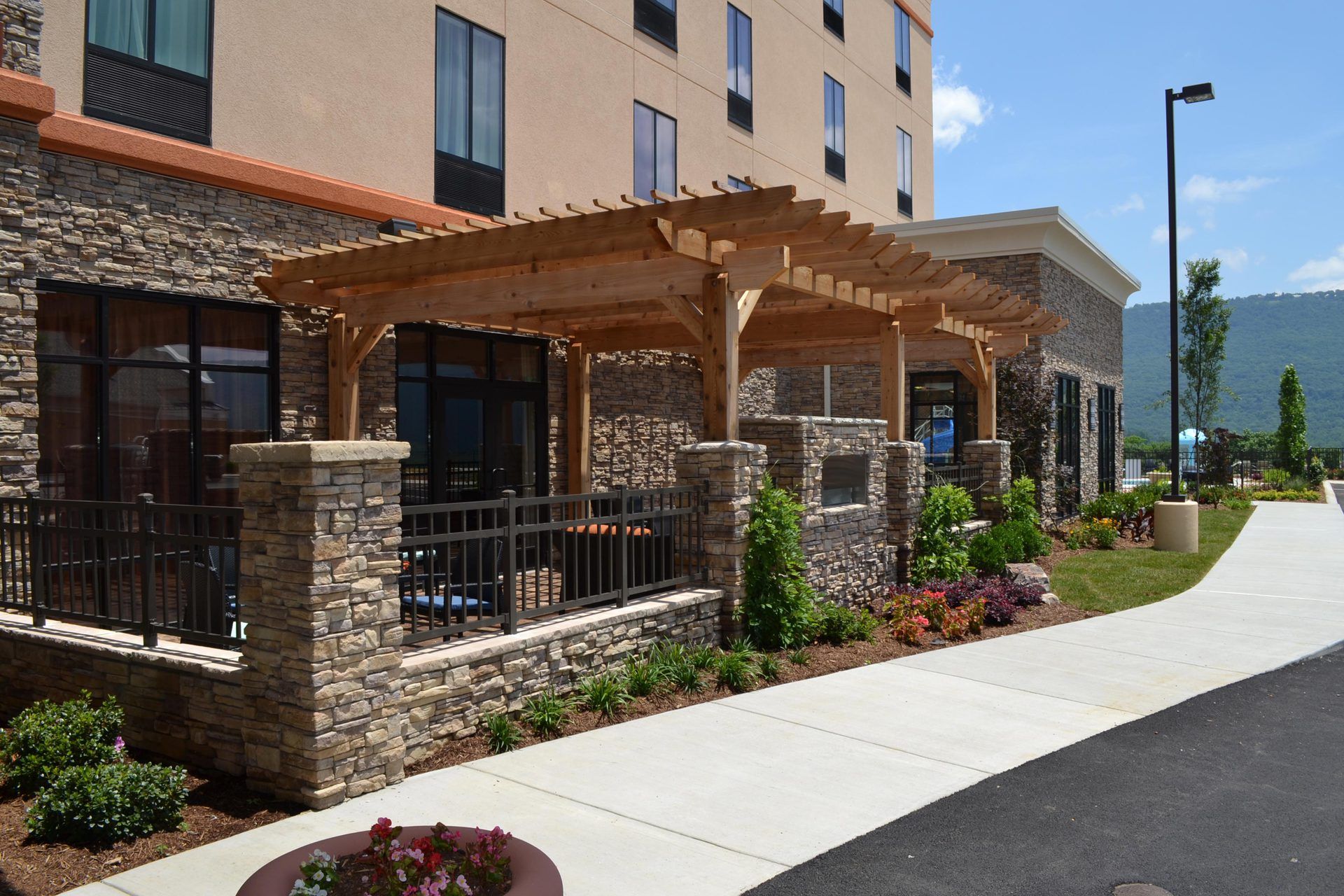 A large building with a pergola in front of it
