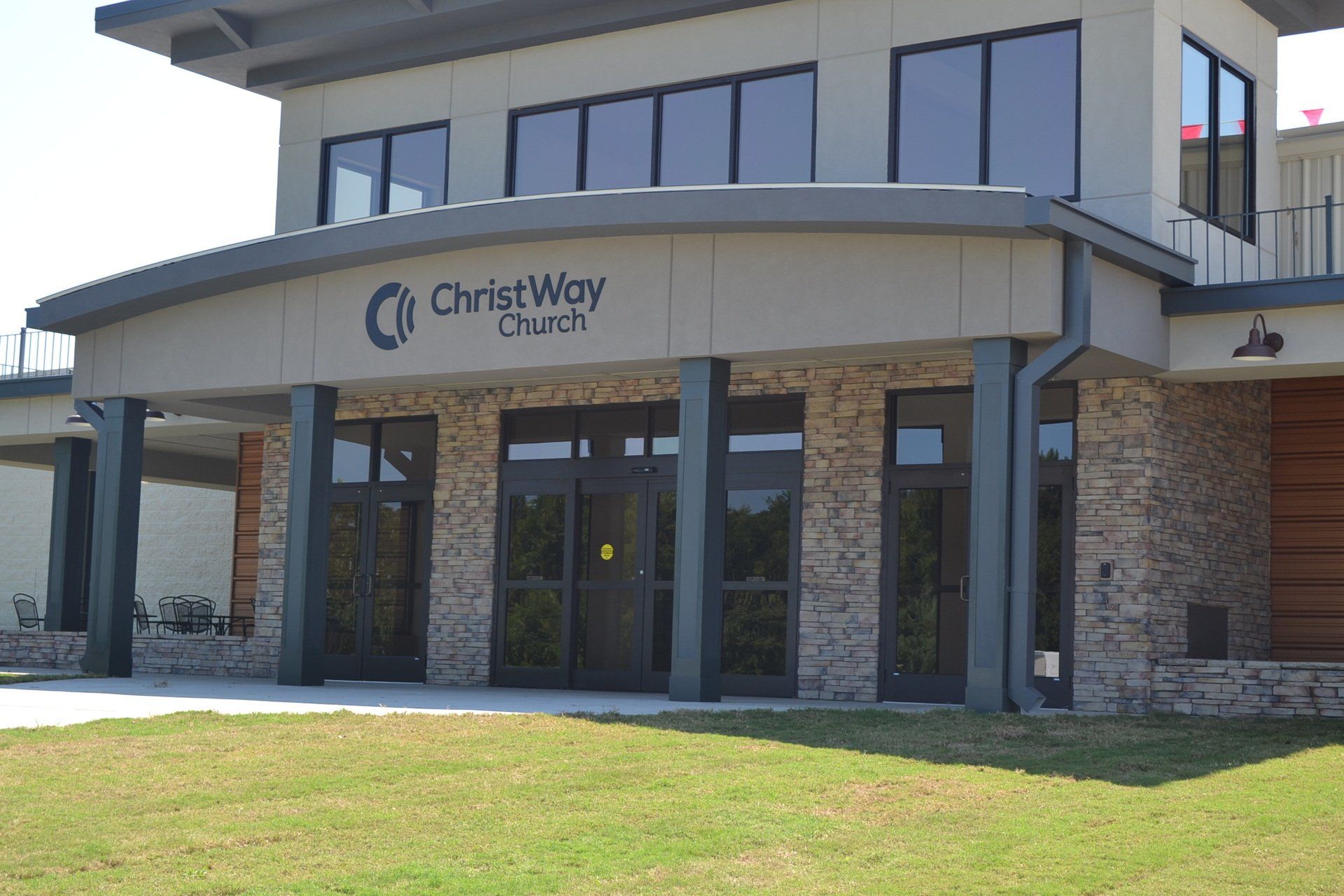 A large building with a lot of windows and a sign that says christ way church.
