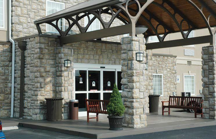 A large stone building with a canopy over the entrance
