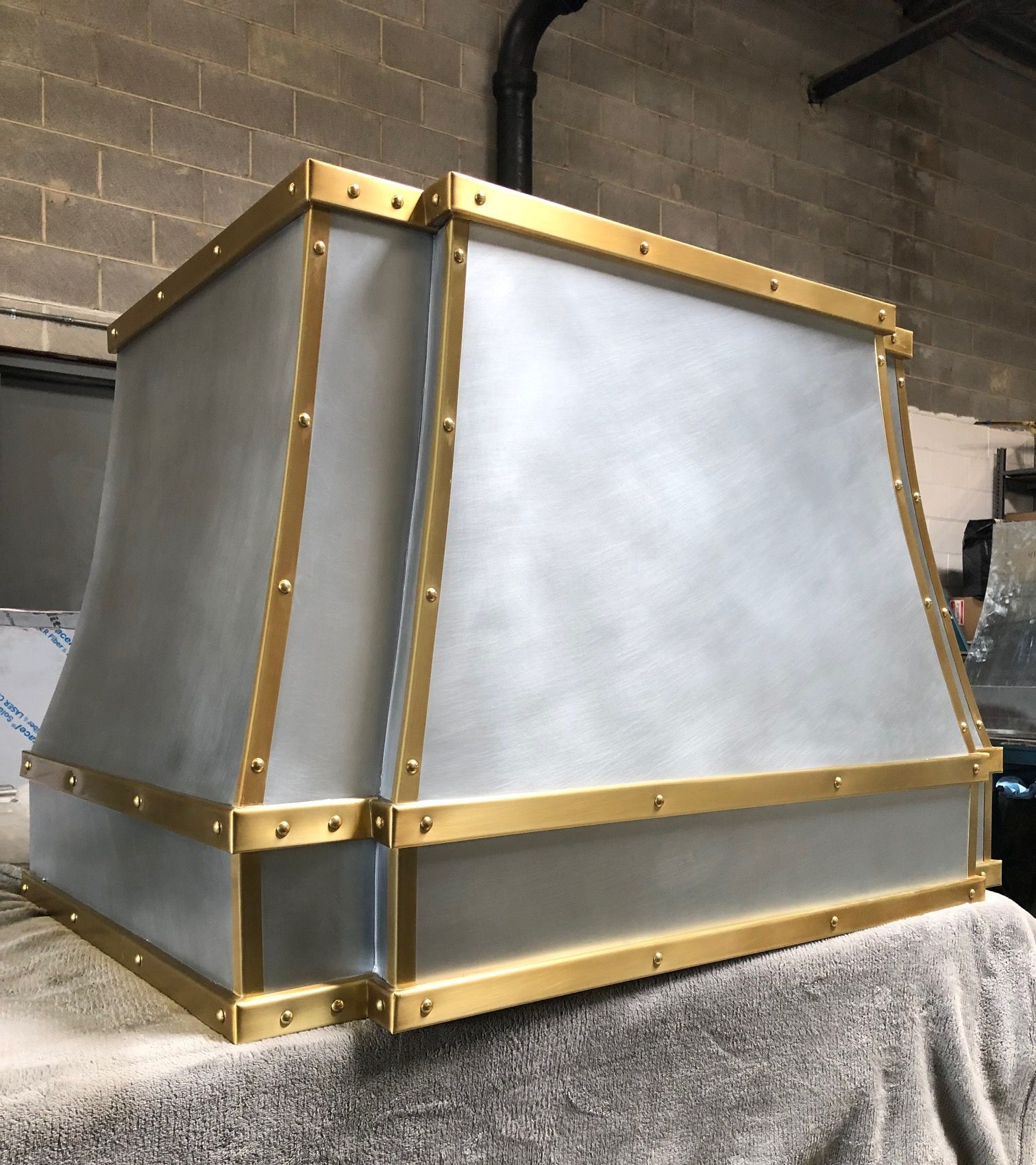 A white box with gold trim sits on a table