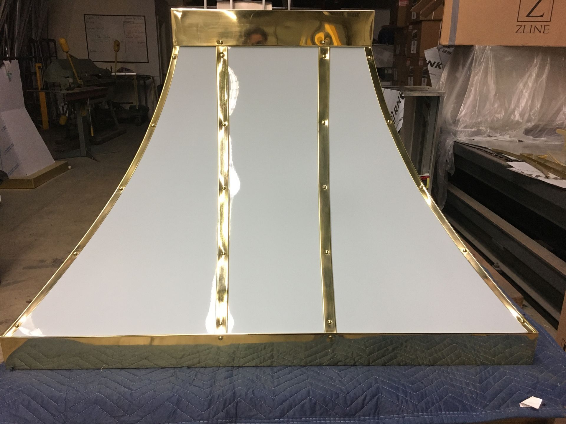 A white and gold item is sitting on a table