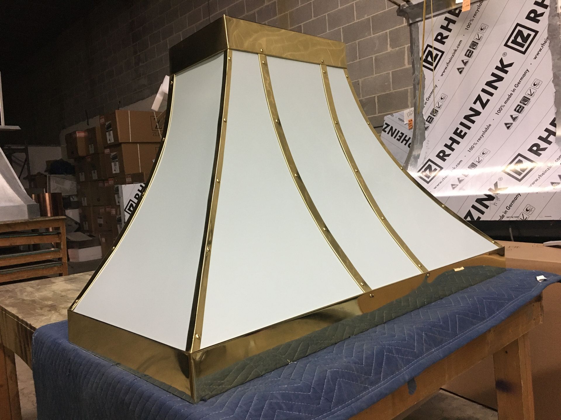 A white and gold item is sitting on a table.