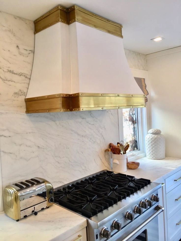 A kitchen with a stove top oven and a toaster oven.