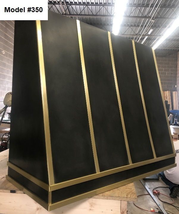 A black and gold hood with the model number 350 on it