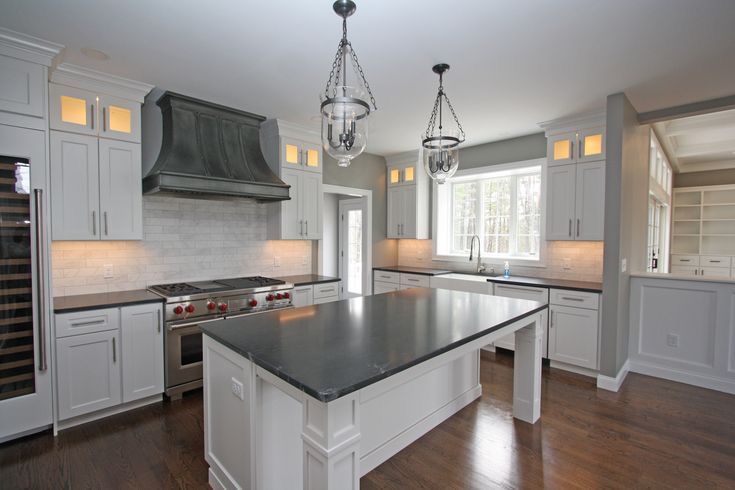 There is a large island in the middle of the kitchen.