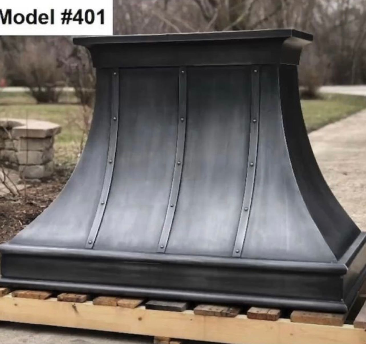 A model # 401 hood is sitting on a wooden pallet