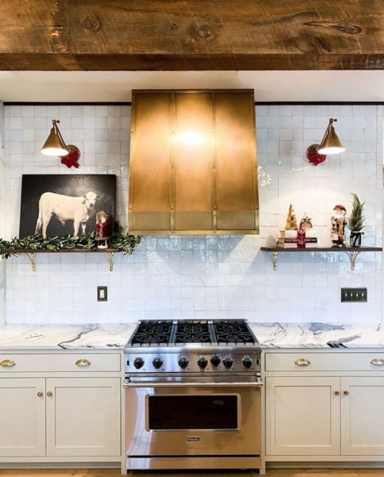 A kitchen with stainless steel appliances and white cabinets