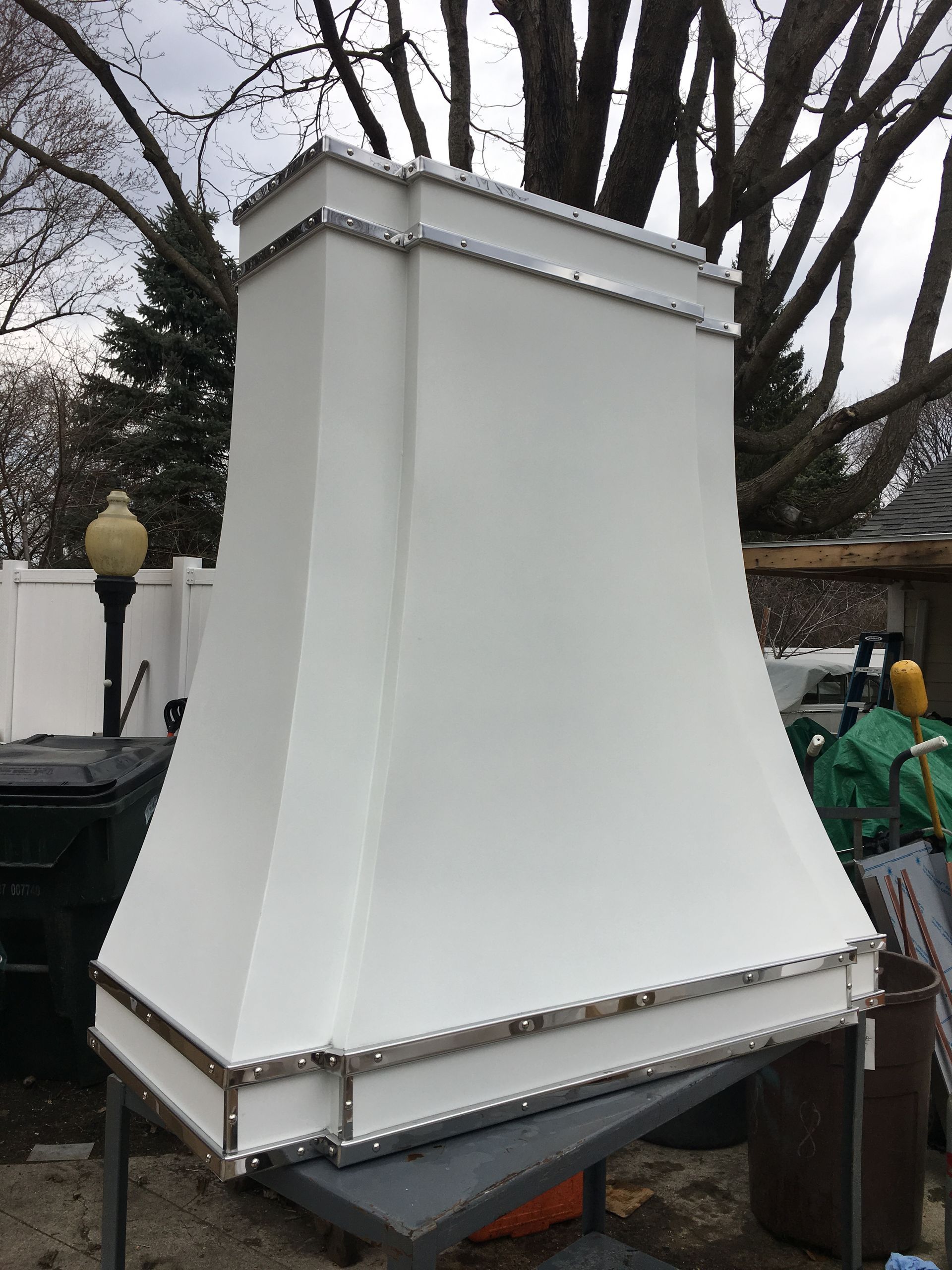 A white chimney is sitting on top of a table.