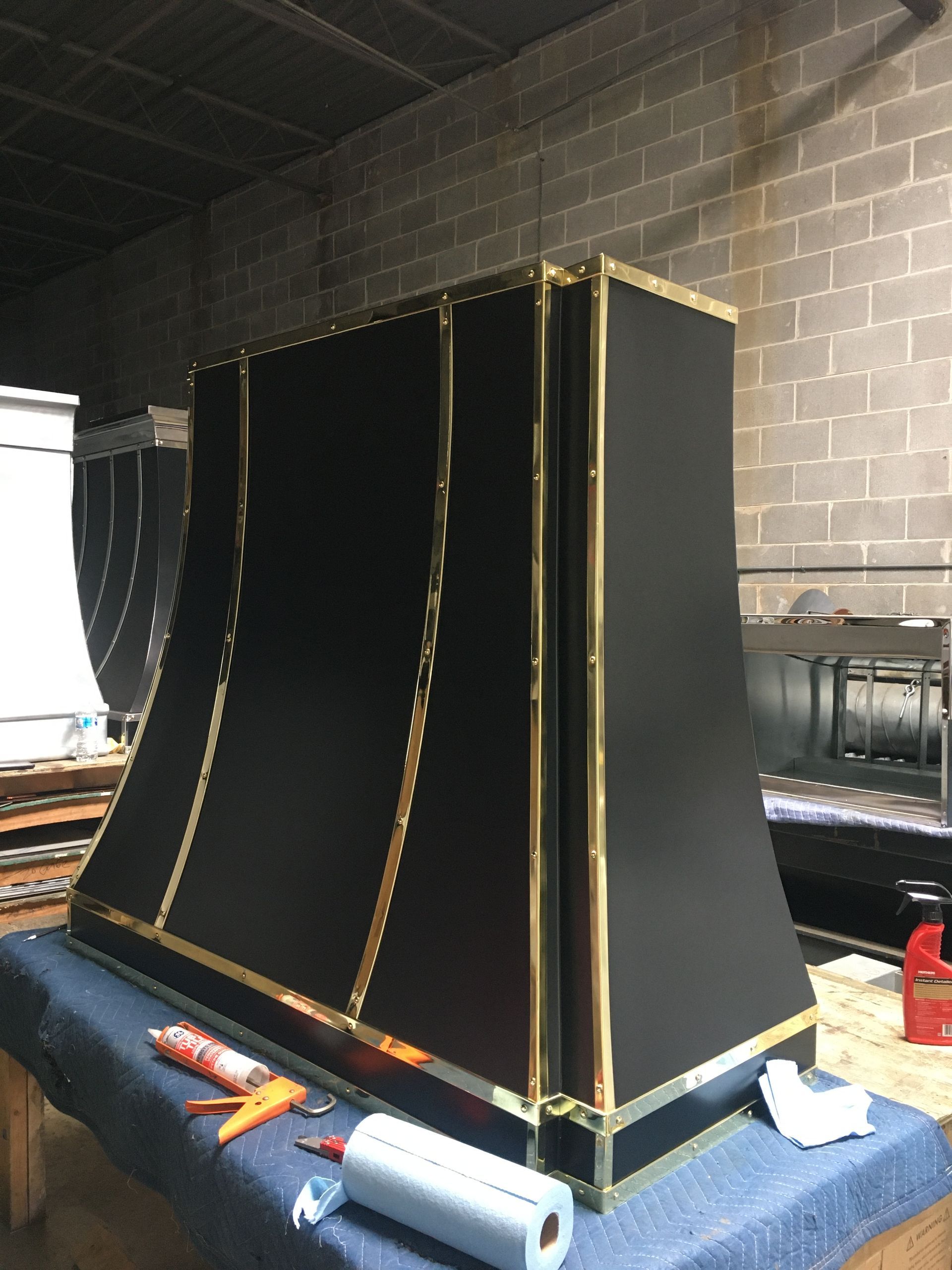 A black and gold item is sitting on a table