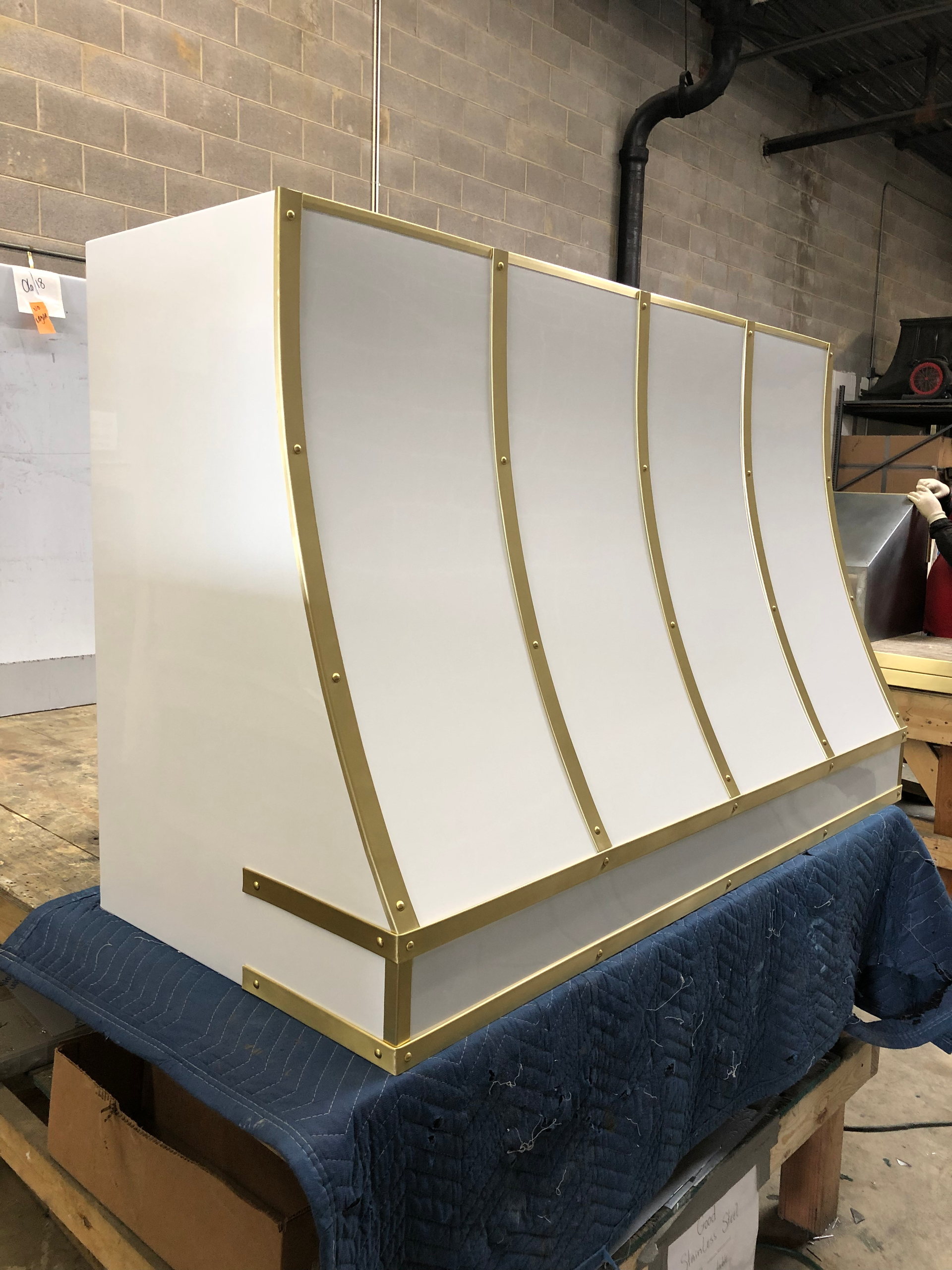 A white box with gold trim is sitting on a table.